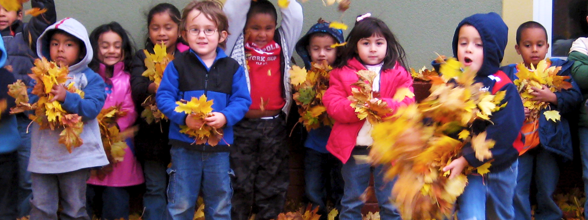 Children with fall leaves